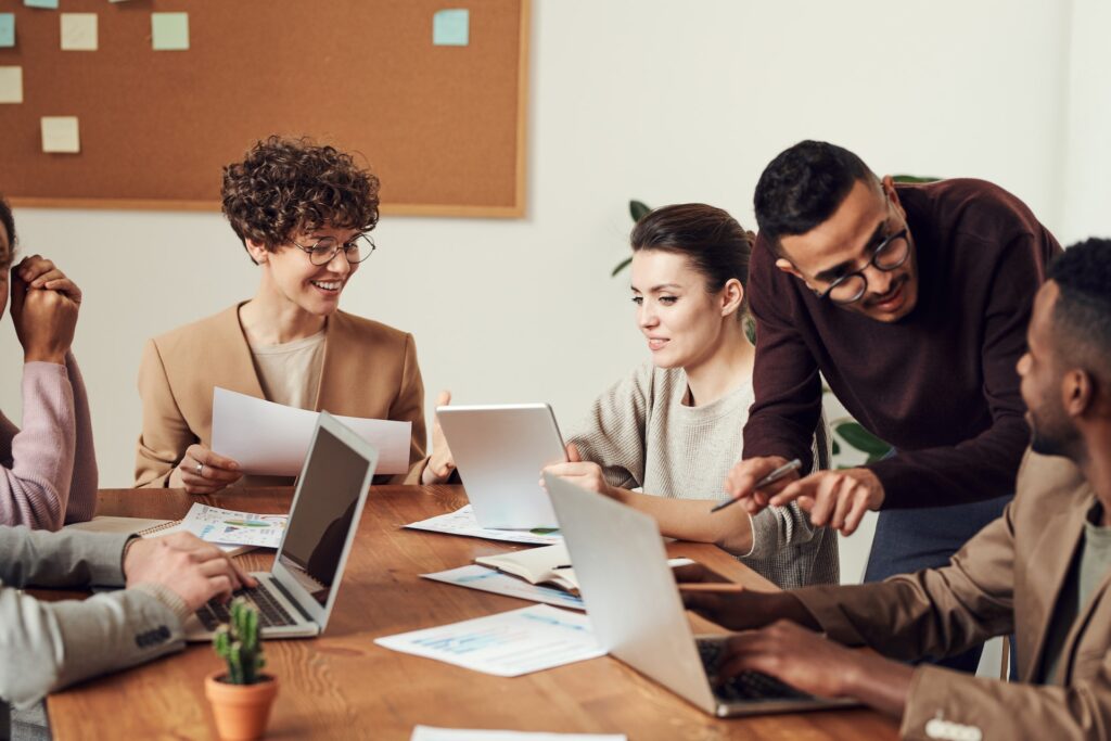 Professionals networking in a coworking space. 